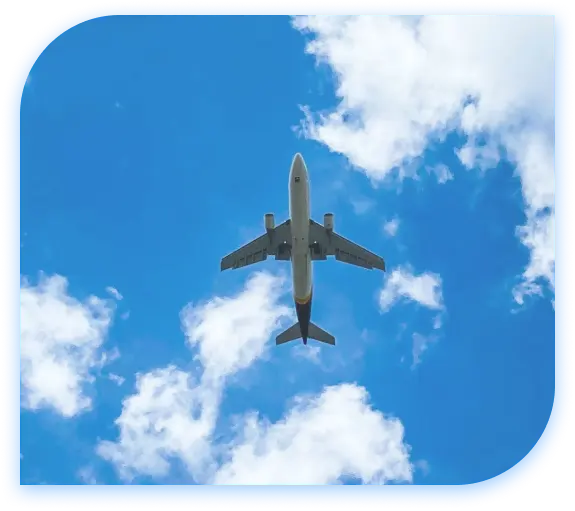 Airplane flying through blue sky with clouds Airplane flying through blue sky with clouds