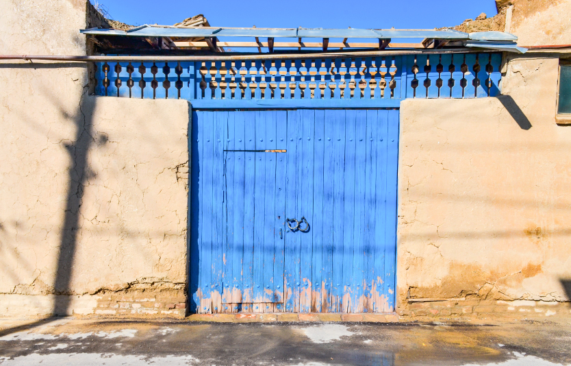 Blue house gates in traditional Uzbek Hazrati Imam mahalla 