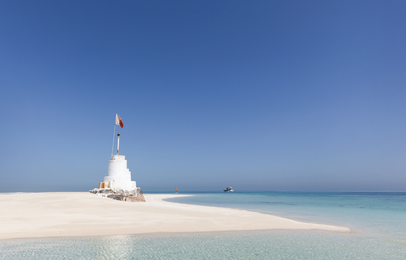 Light house tower with Bahrain flag at Jarada island