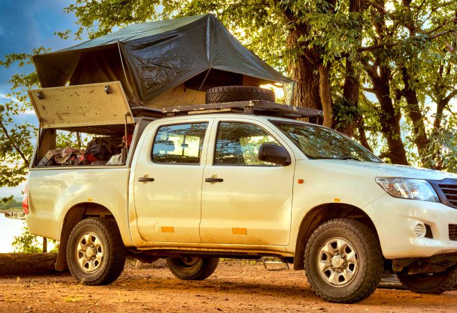 Camping in Zambia with 4x4 truck and rooftop tent equipped for safari trips